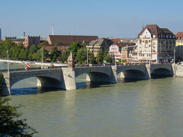 Bridges on the Rhine in Basel. The middle bridge 'Mittlere Brücke' and Kleinbasel. Most buildings on this photo did already exist 100 years ago.